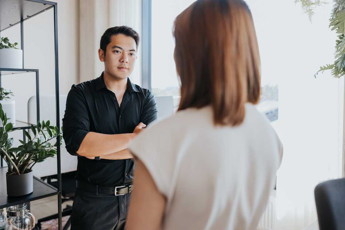 A man and a woman in a serious conversation
