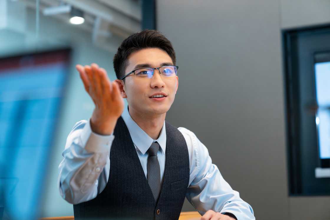 Businessman speaking during a meeting in the conference room Businessman speaking during a meeting in the conference room