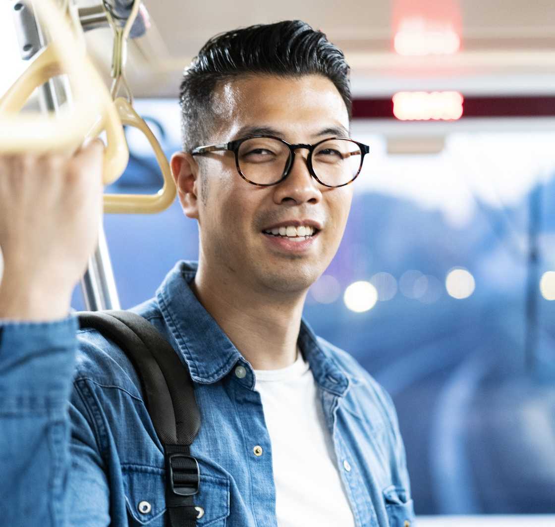 A man talking with someone in public transport A man talking with someone in public transport