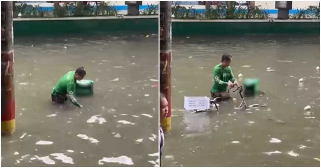 Delivery rider, pilit sinasalba ang lumubog na bisikleta sa abot-baywang na baha sa Maynila
