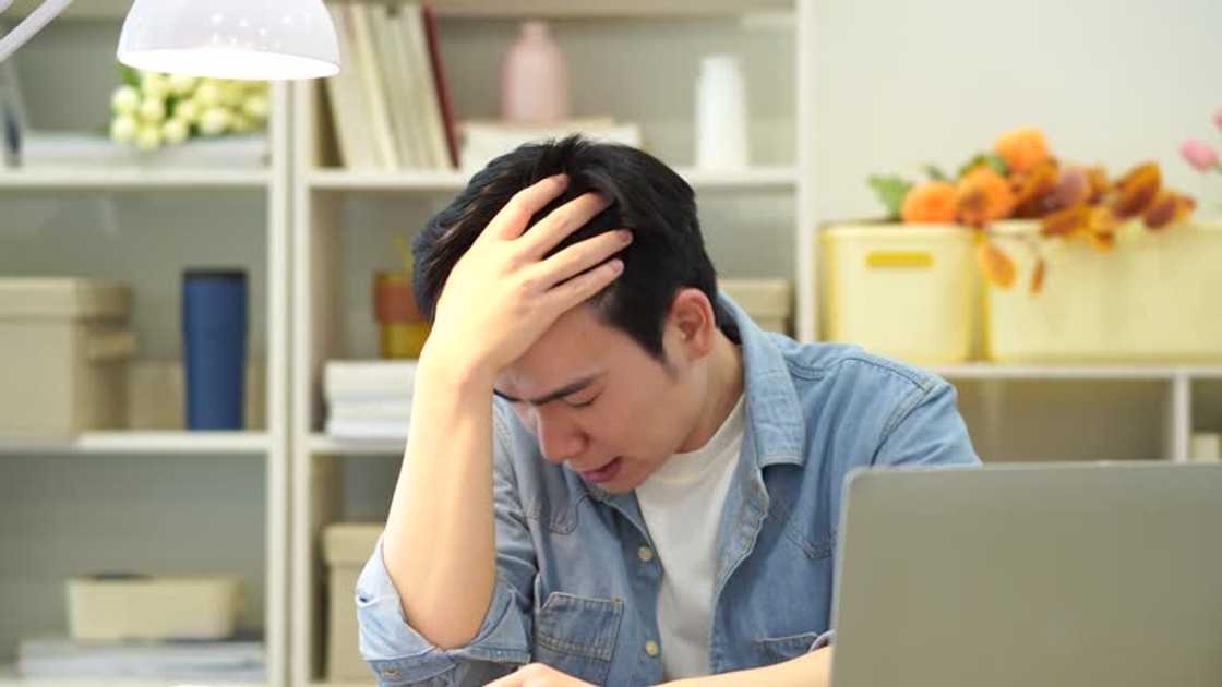 A frustrated young Asian man A frustrated young Asian man