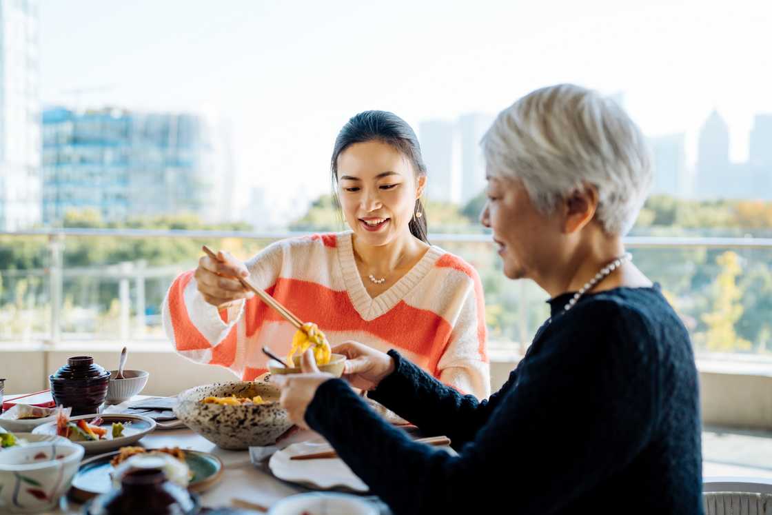 A mother and grand daughter at a restaurant A mother and grand daughter at a restaurant