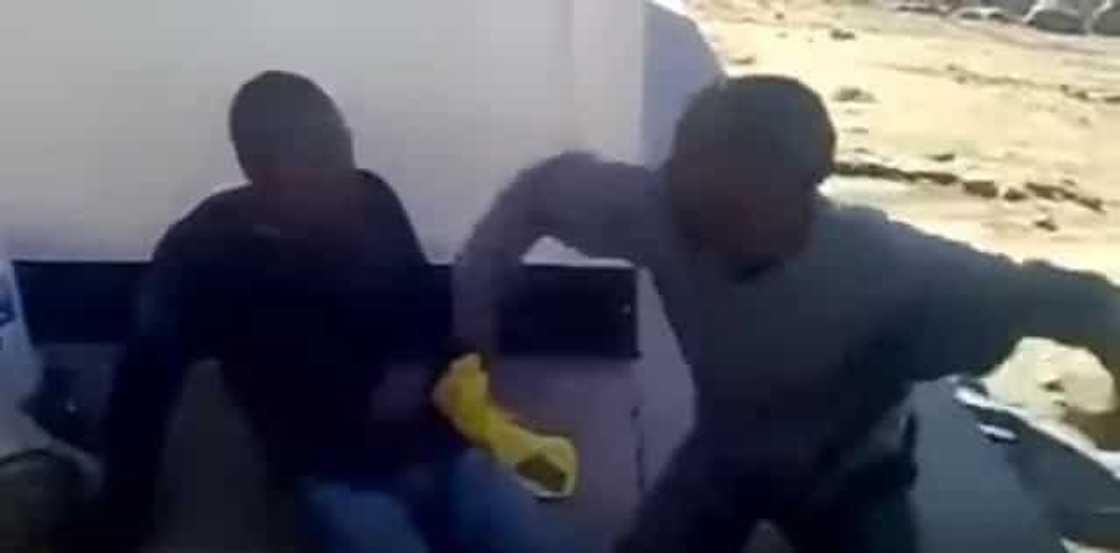 Two thieves are made to beat each other as punishment