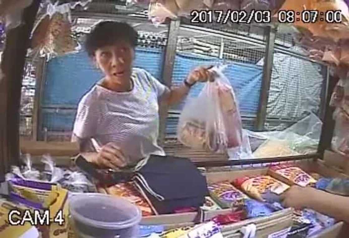 CCTV caught a woman in the act of stealing. CCTV caught a woman in the act of stealing.