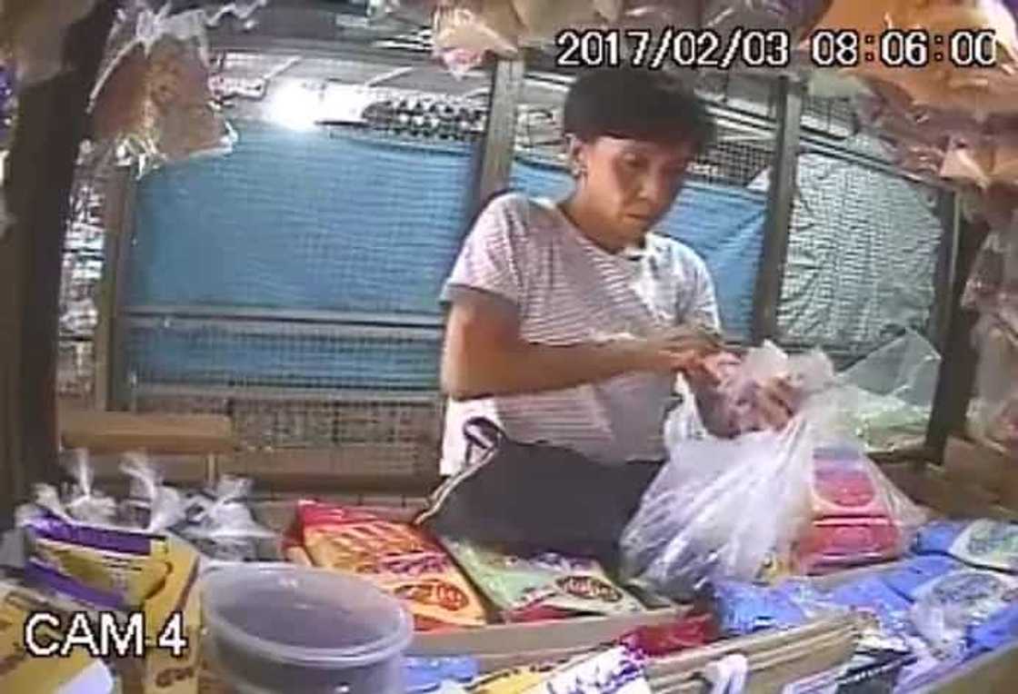 CCTV caught a woman in the act of stealing. CCTV caught a woman in the act of stealing.