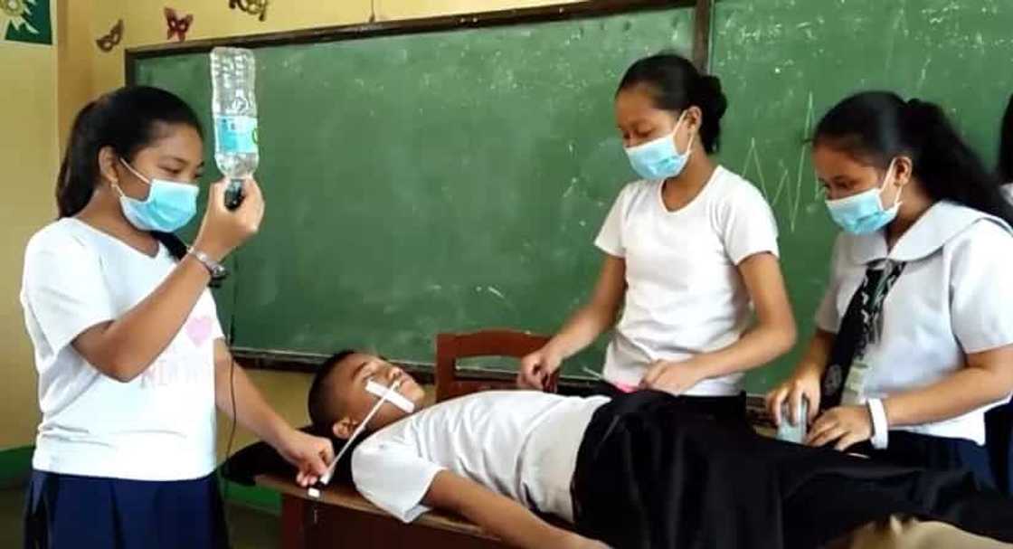 Filipino group of students deliver a funny 'medical' presentation for class Filipino group of students deliver a funny 'medical' presentation for class