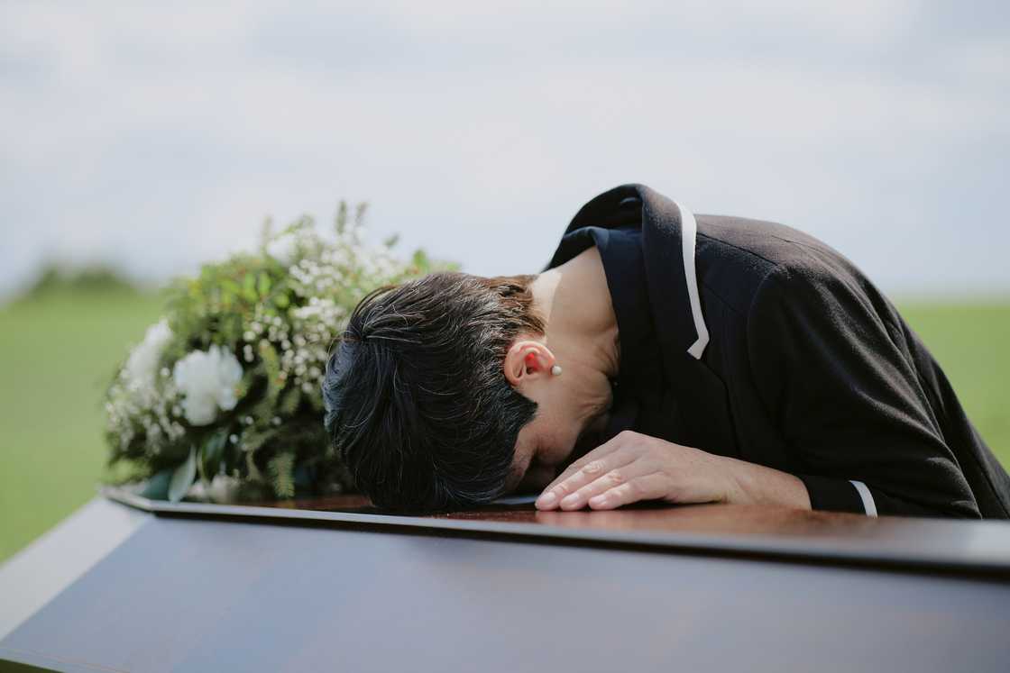 A woman during a funeral A woman during a funeral