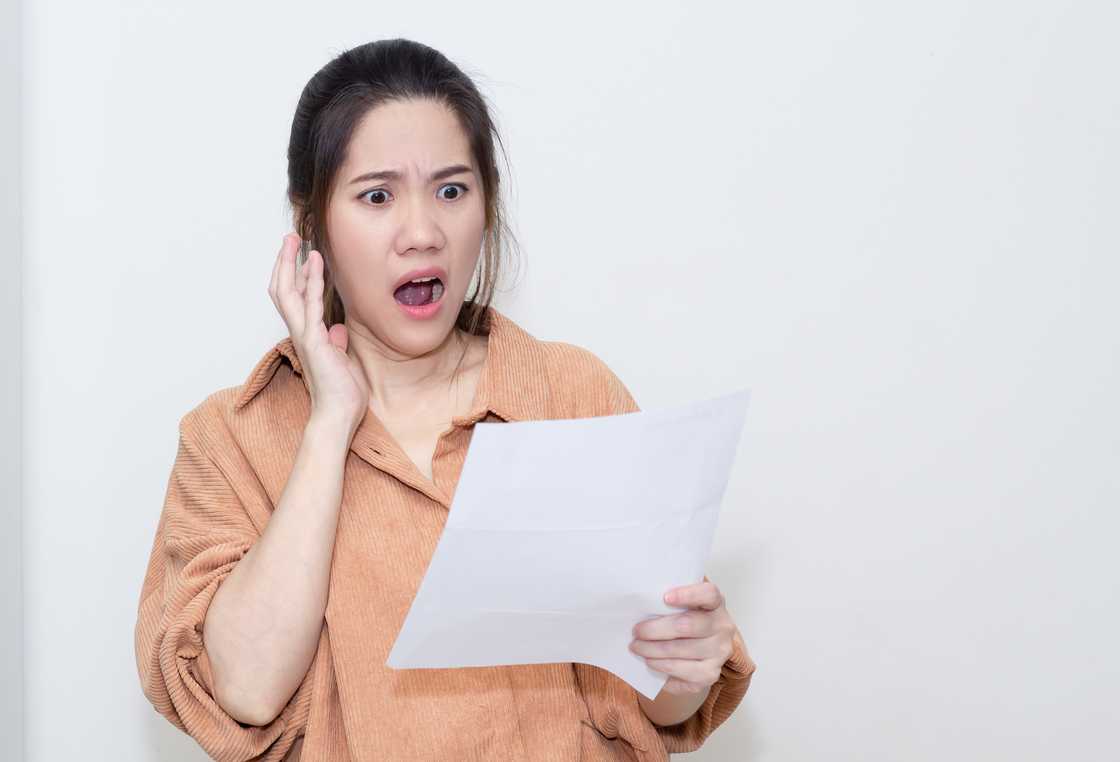 A woman feeling worried and shocked
