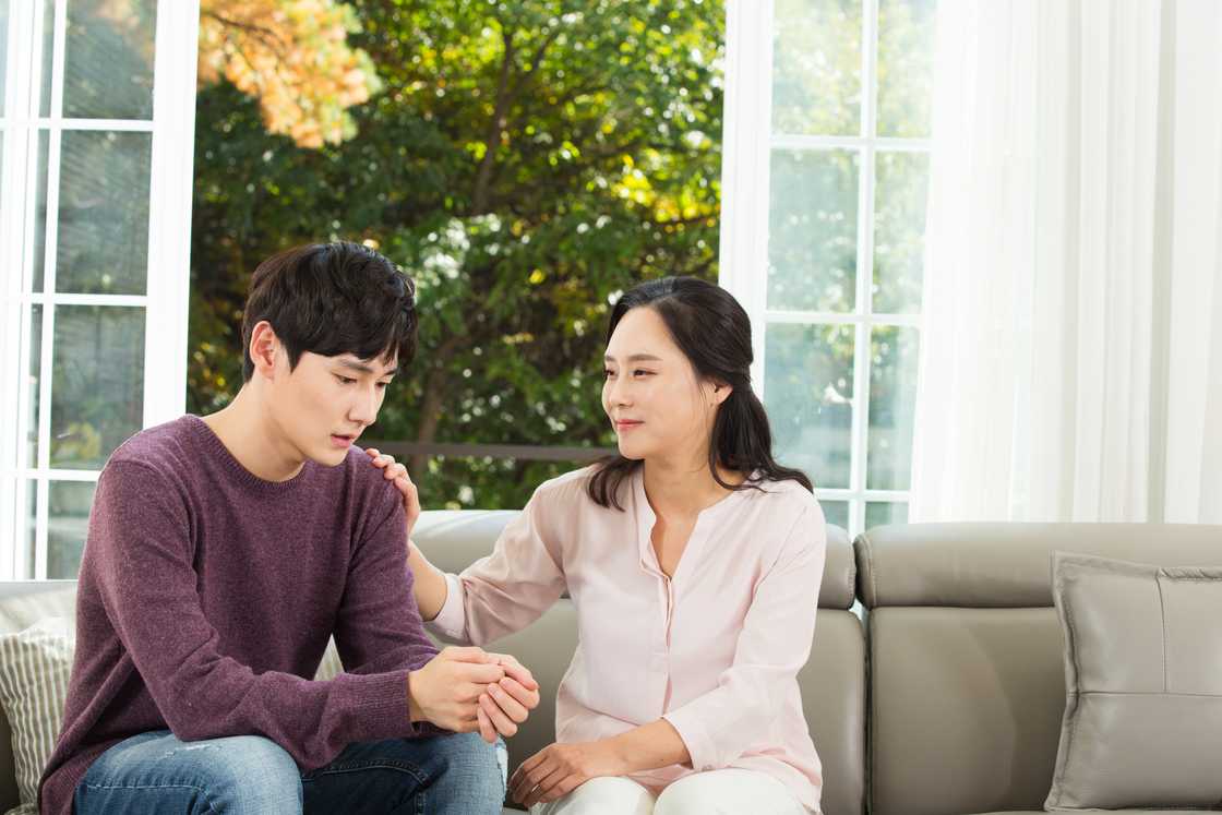 Son telling his worries to his mom