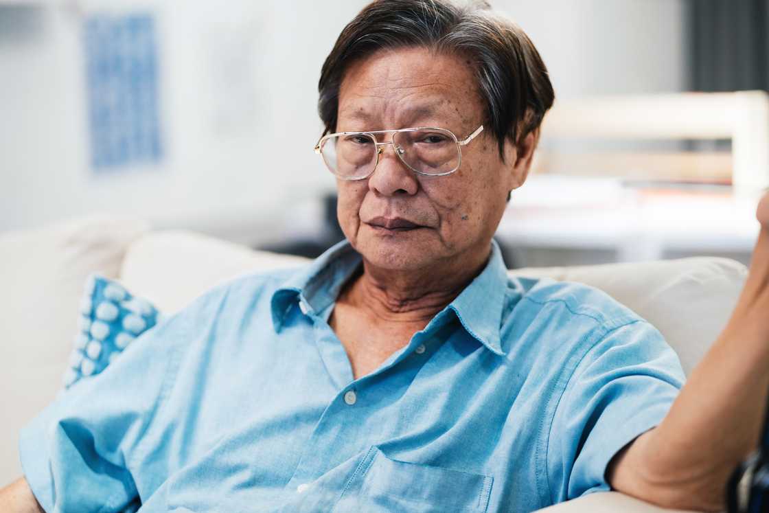 An elderly man on the sofa