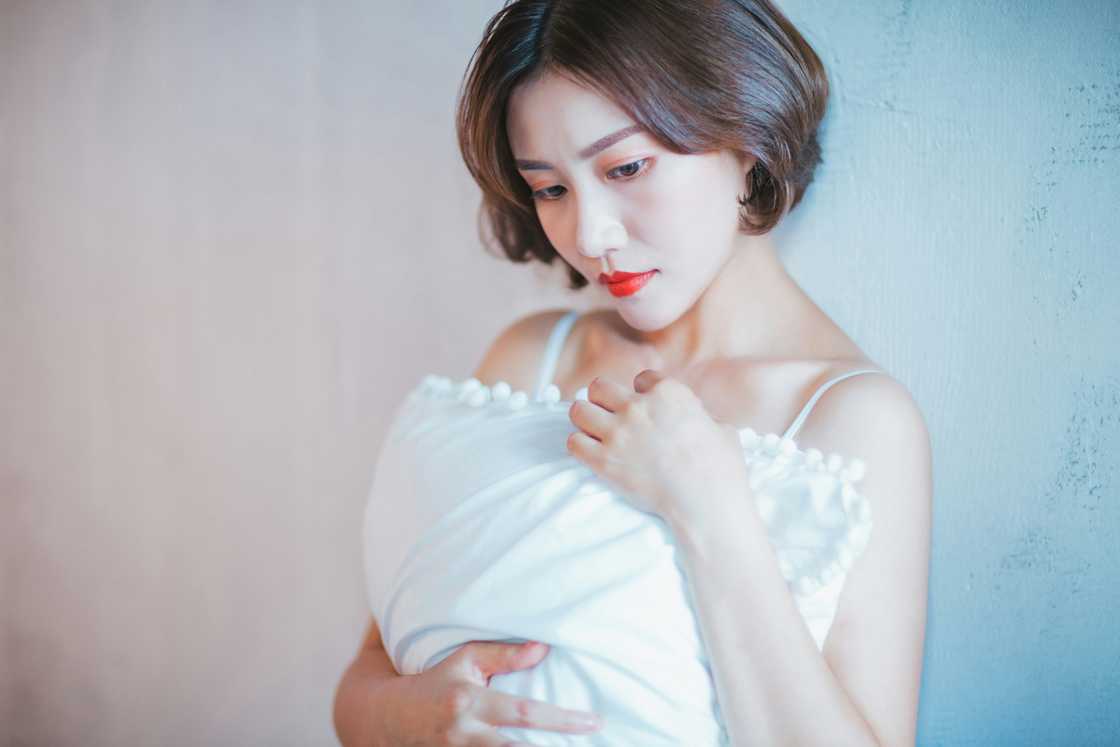 A woman holding a baby A woman holding a baby
