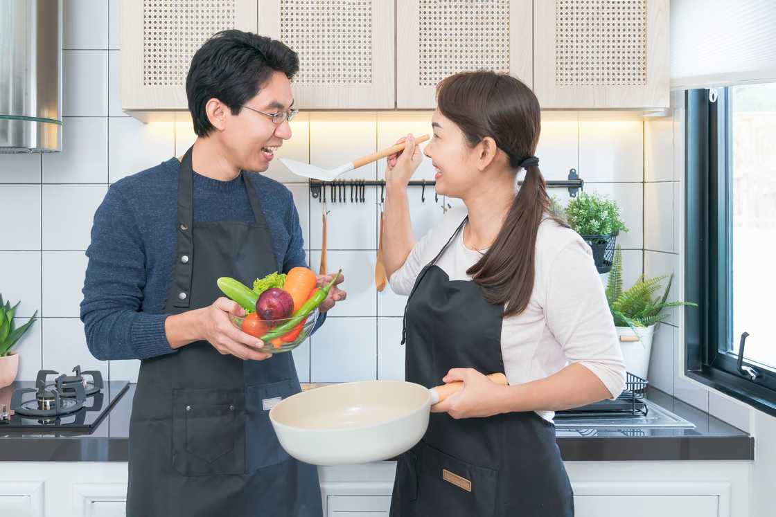 A couple cooking together