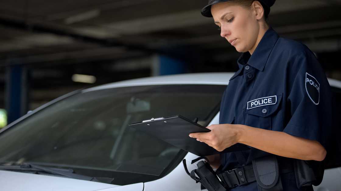 A police officer checking info for law enforcement