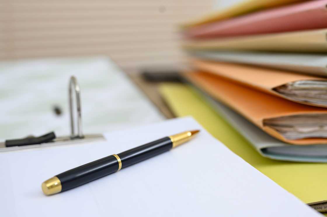 Files and a pen on the desk