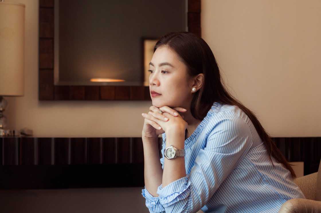 Novels Asian woman deep in thought