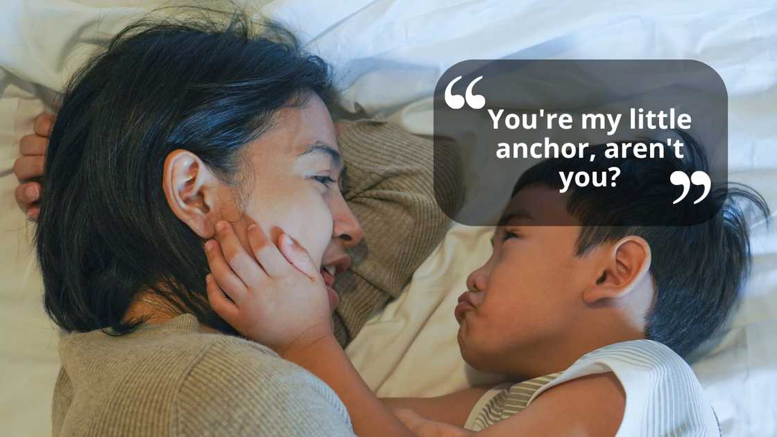 A woman rocking her son to sleep