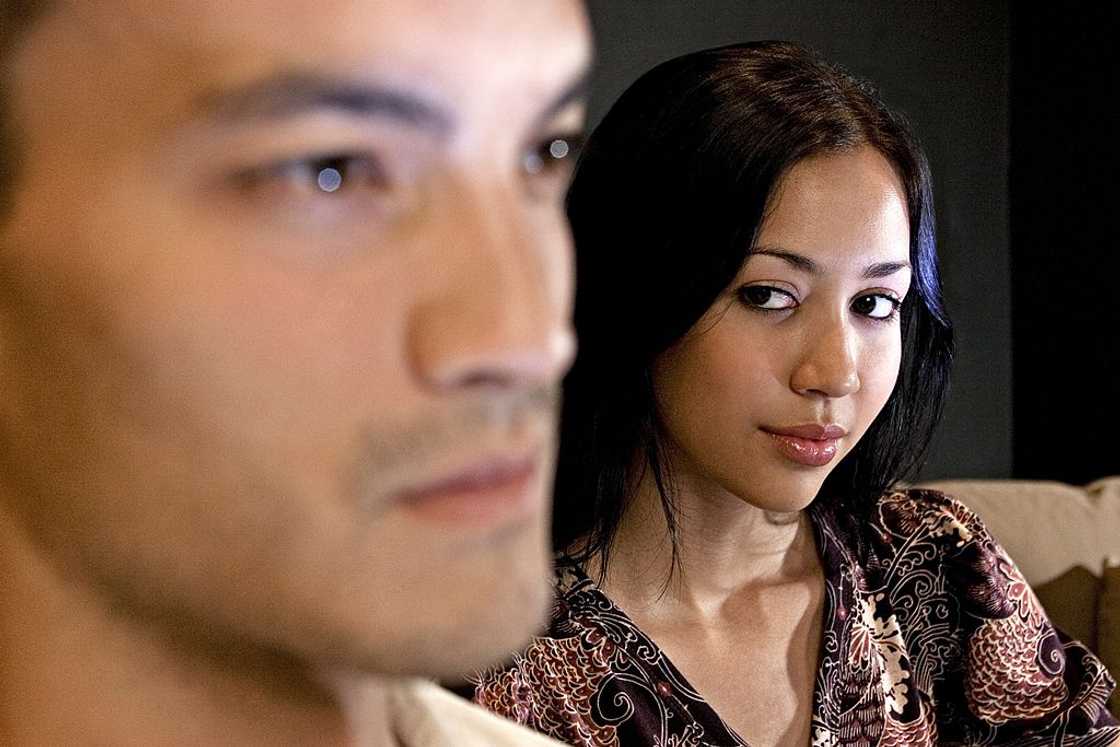 Asian couple appear to be quarrelling.