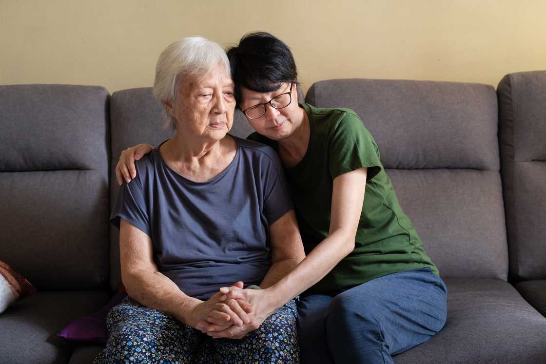 An Asian woman is spending time with her mother