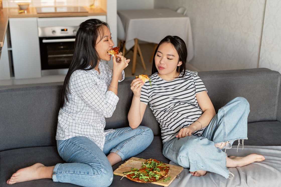 Two women conversing during a public outing. Two women conversing during a public outing.