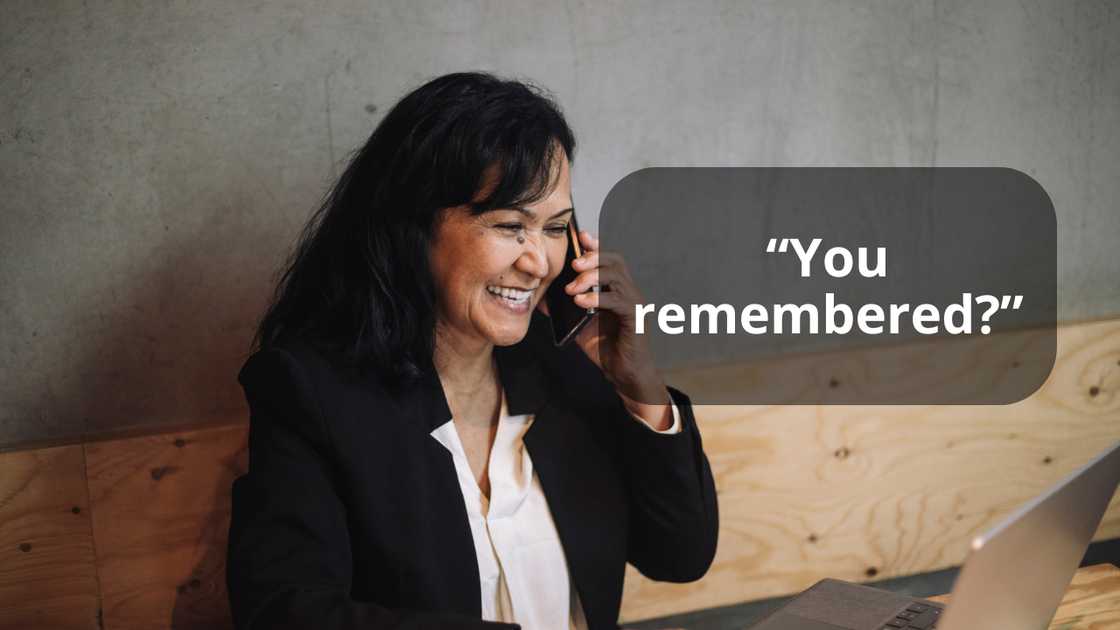 A smiling woman on a call