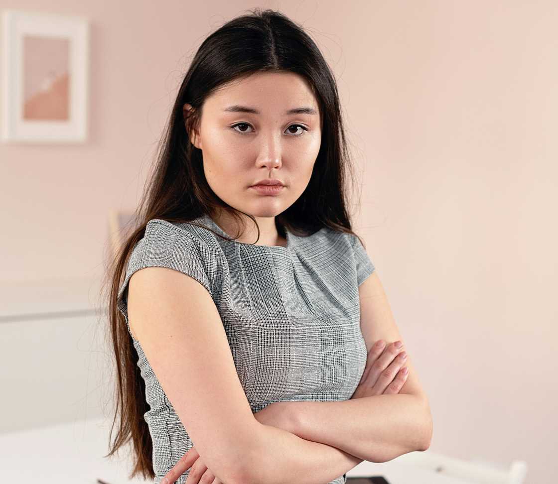 A woman crossing her arms A woman crossing her arms