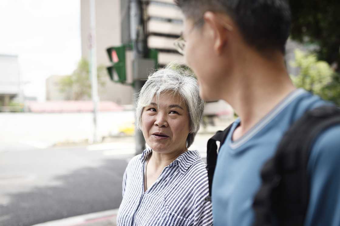 A mother talking to her son A mother talking to her son