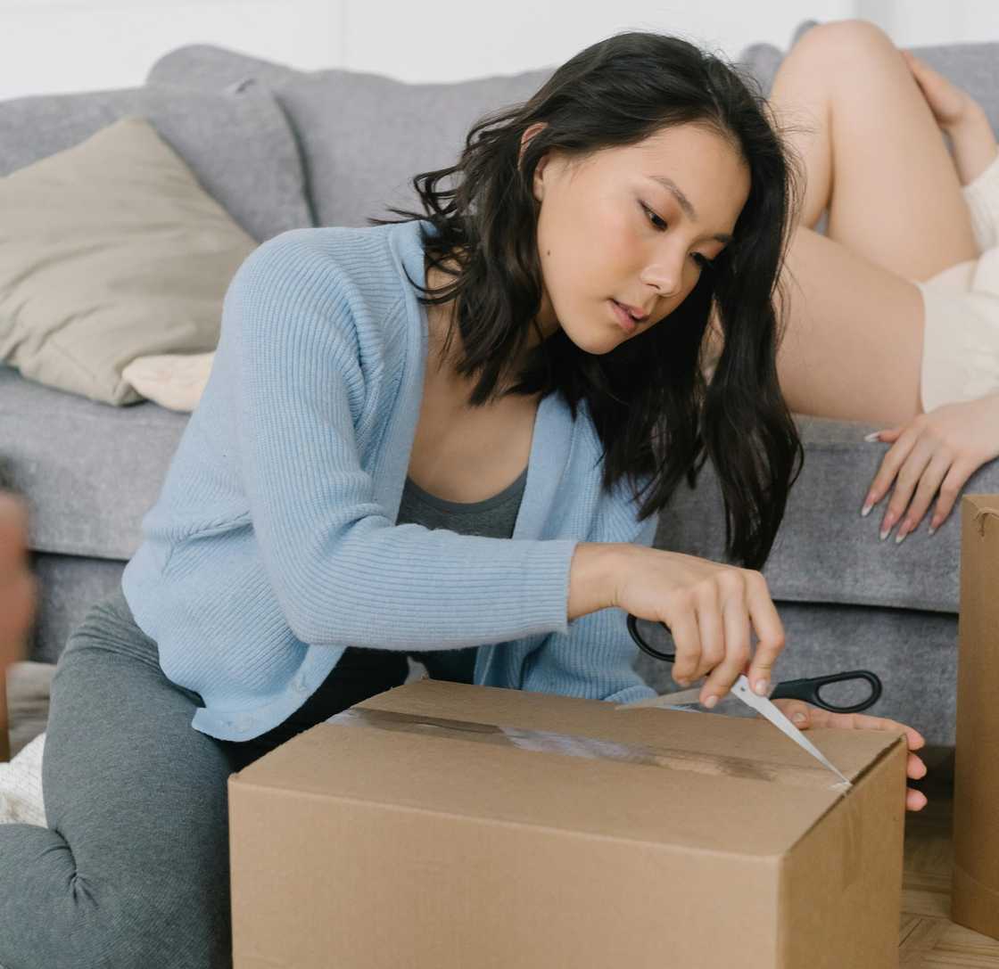 A woman packing a box