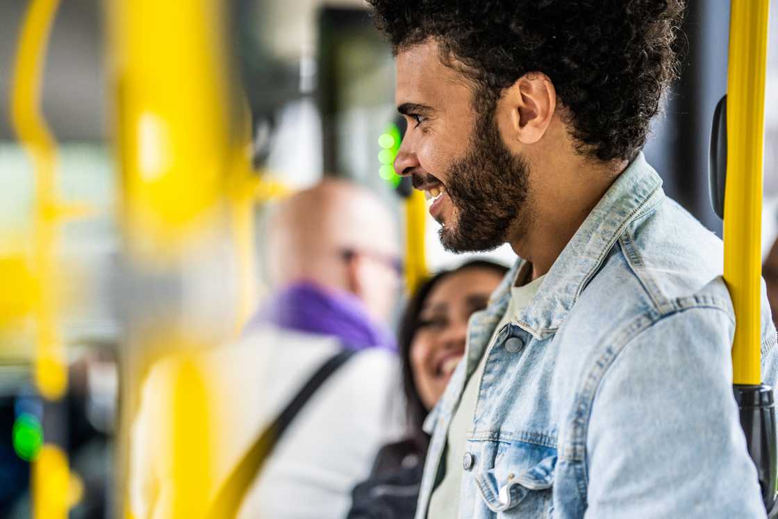 A student talking to someone in a bus