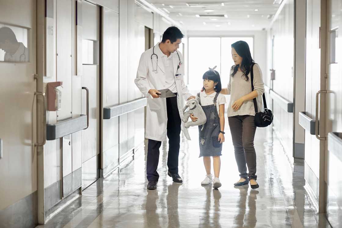A young girl with her mom in hospital