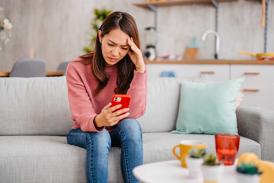 A woman holding her phone A woman holding her phone