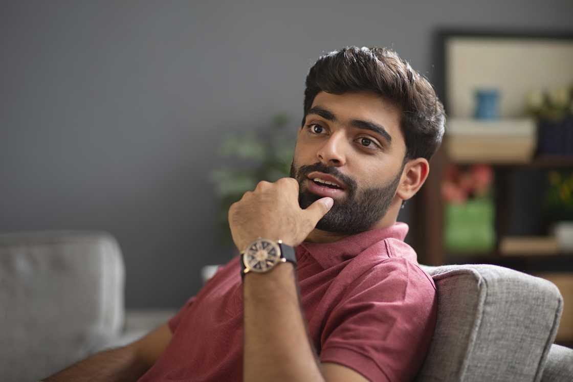 A man wears an expensive wrist watch