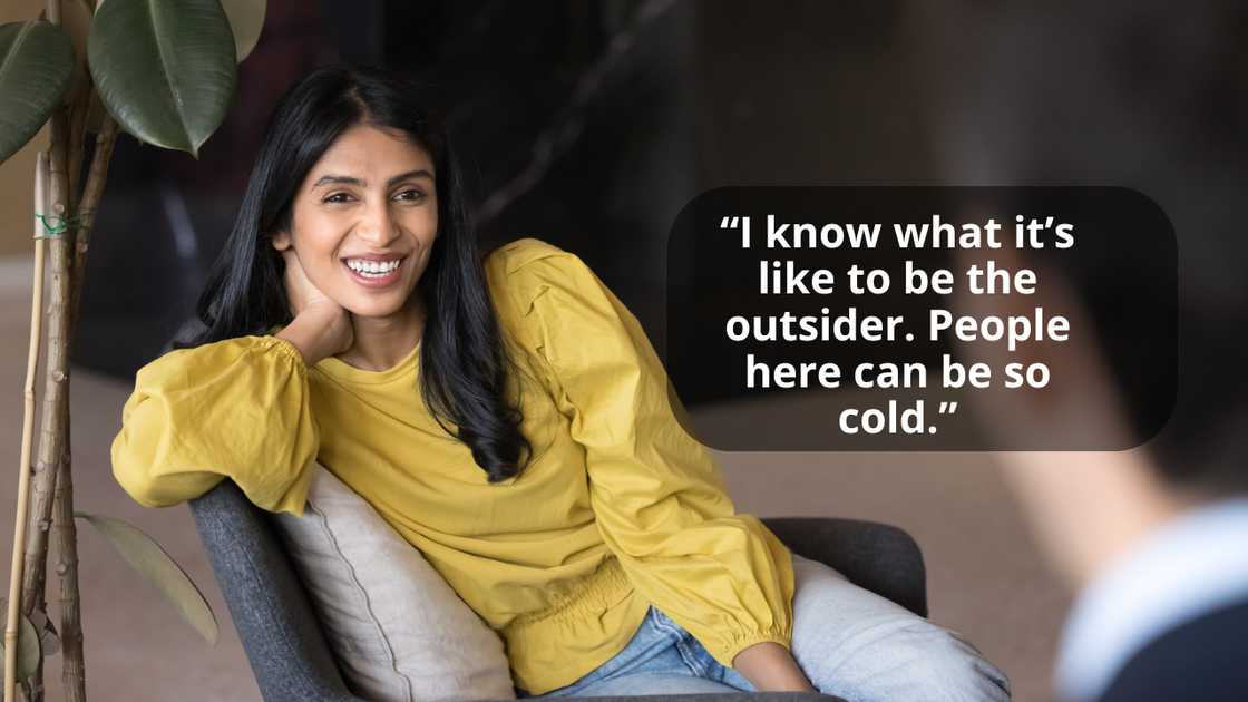 A female coworker talking with her friend in the office