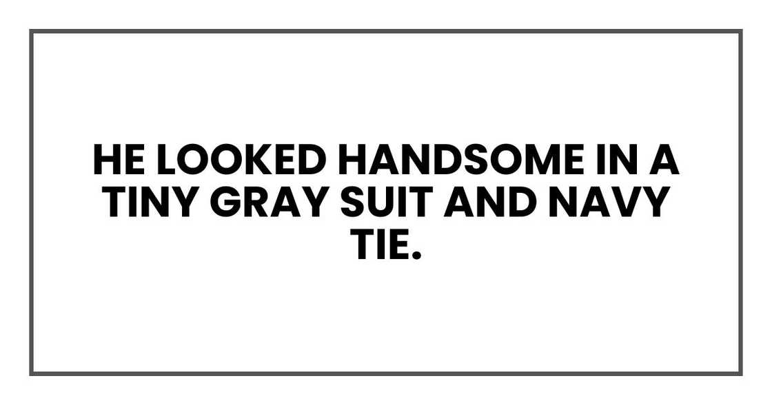 He looked handsome in a tiny gray suit and navy tie. He looked handsome in a tiny gray suit and navy tie.