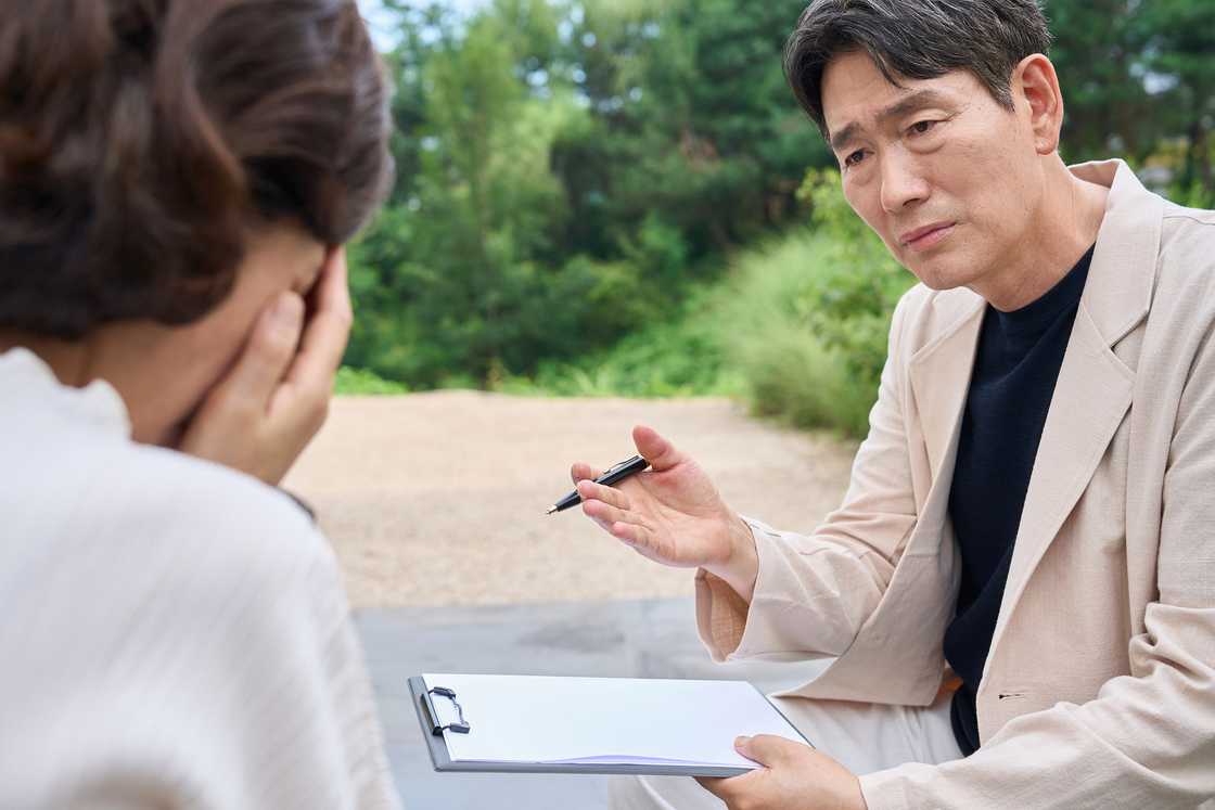 A worried woman talking to her boss A worried woman talking to her boss