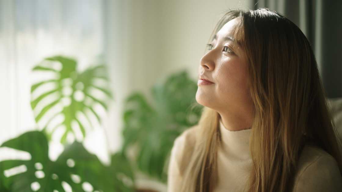 A woman relax on sofa at home.