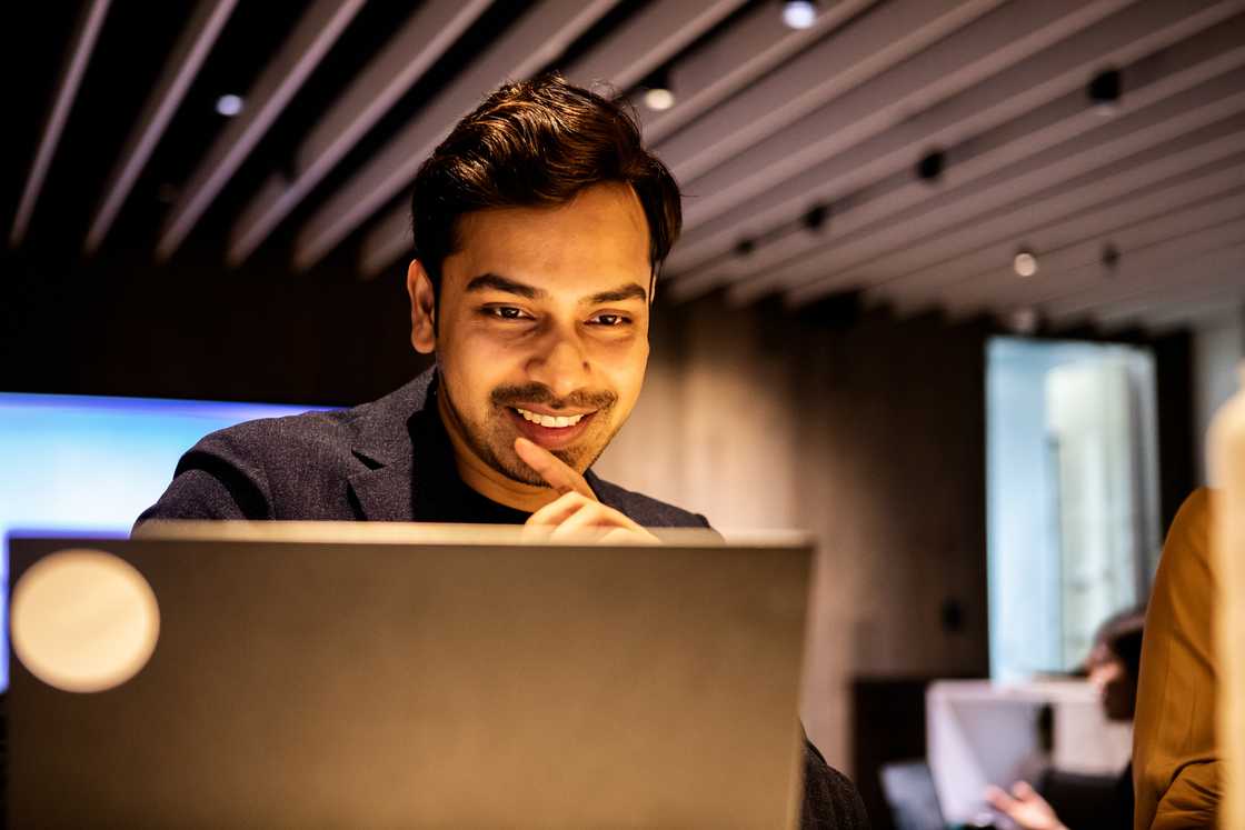 A smiling man working in an office