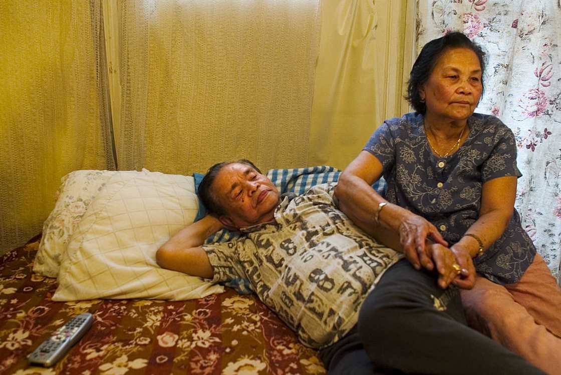 Elder man and woman sit with each other. Elder man and woman sit with each other.