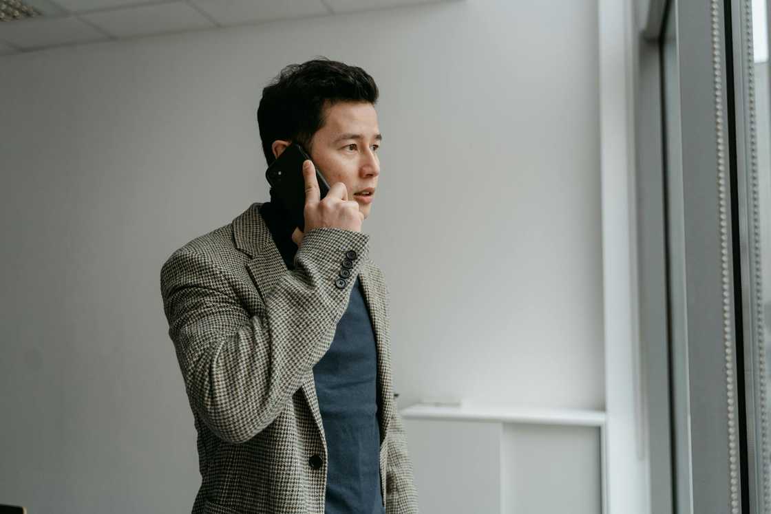 A man on a phone call. A man on a phone call.