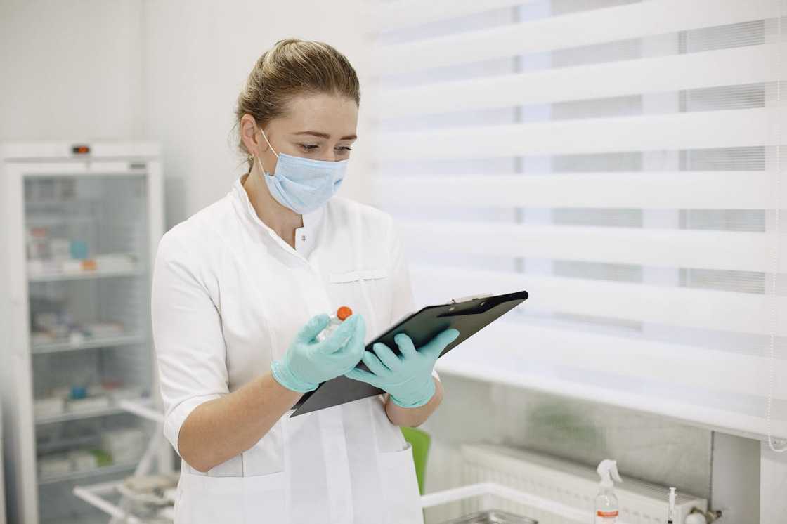 A nurse reviewing medical notes.