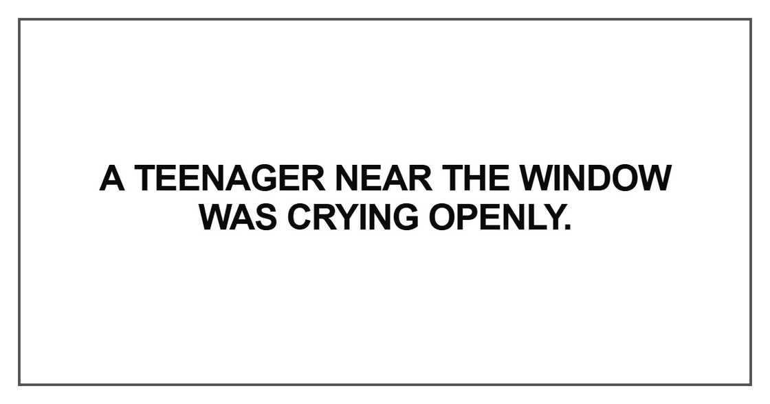 A teenager near the window was crying A teenager near the window was crying
