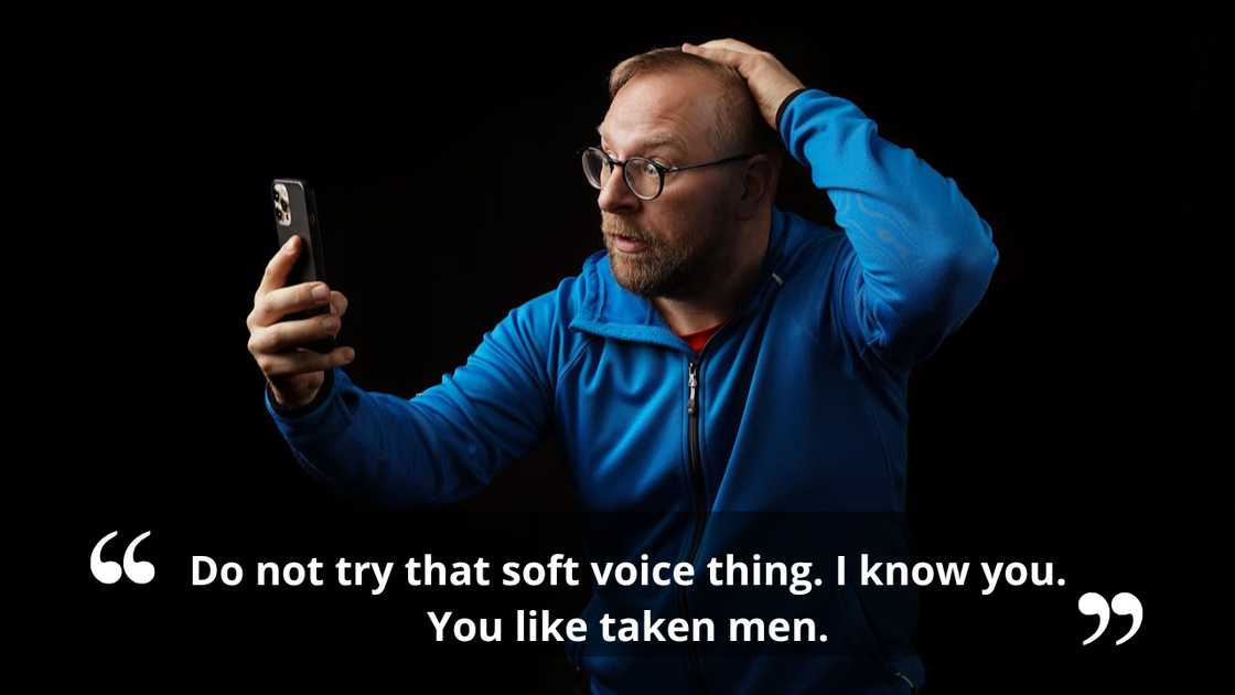 A man looks at his phone with a surprised expression.