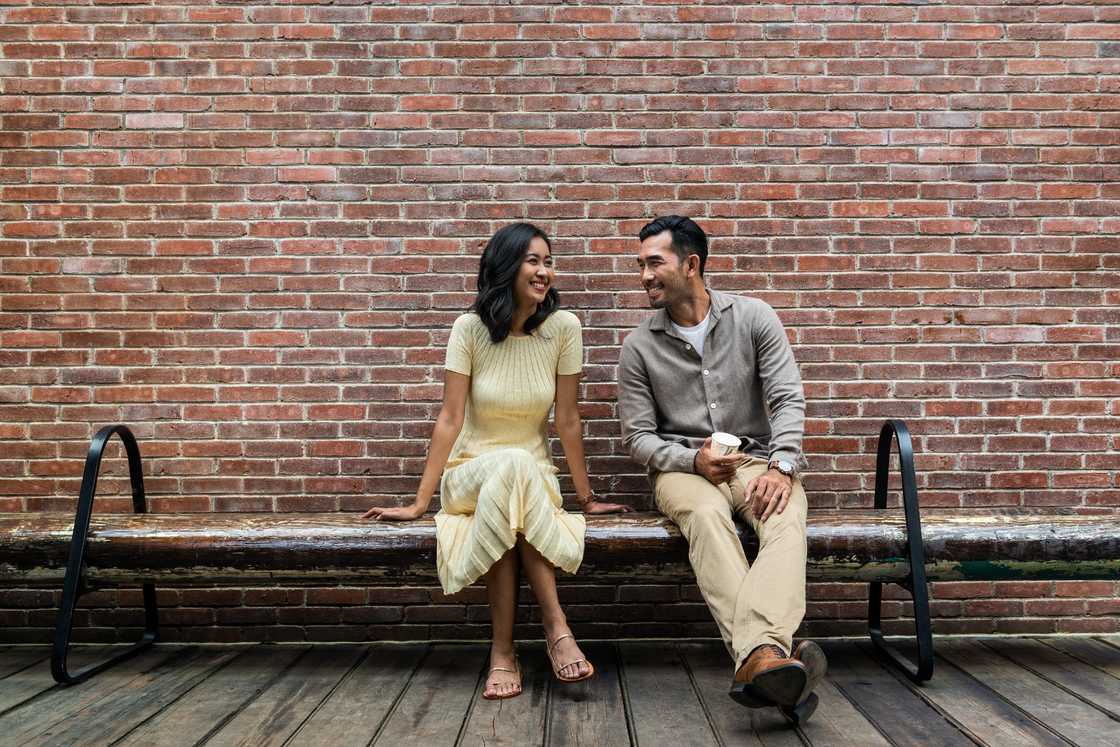 Asian man talking to a lady