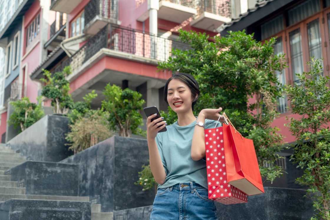 A woman carrying shopping bags