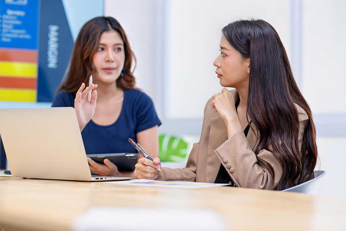 The marketing development team is in a market strategy meeting The marketing development team is in a market strategy meeting