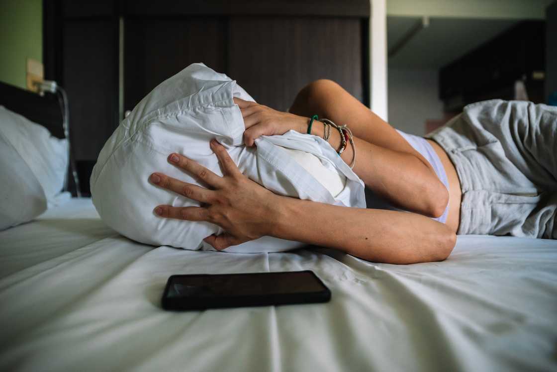 A lady depressed in bed