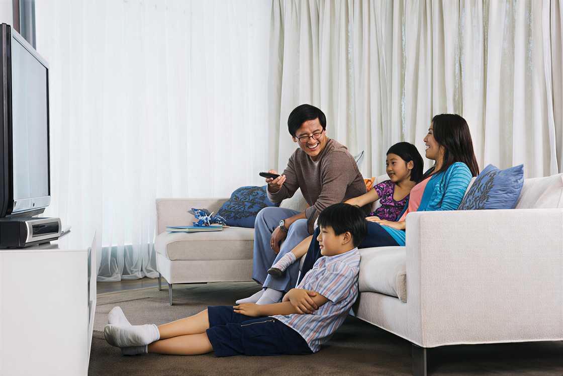 An Asian family watching TV An Asian family watching TV