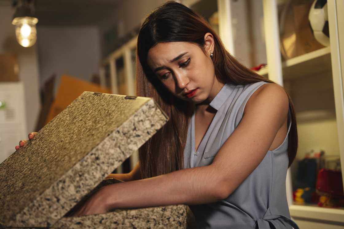 A girl with a big box