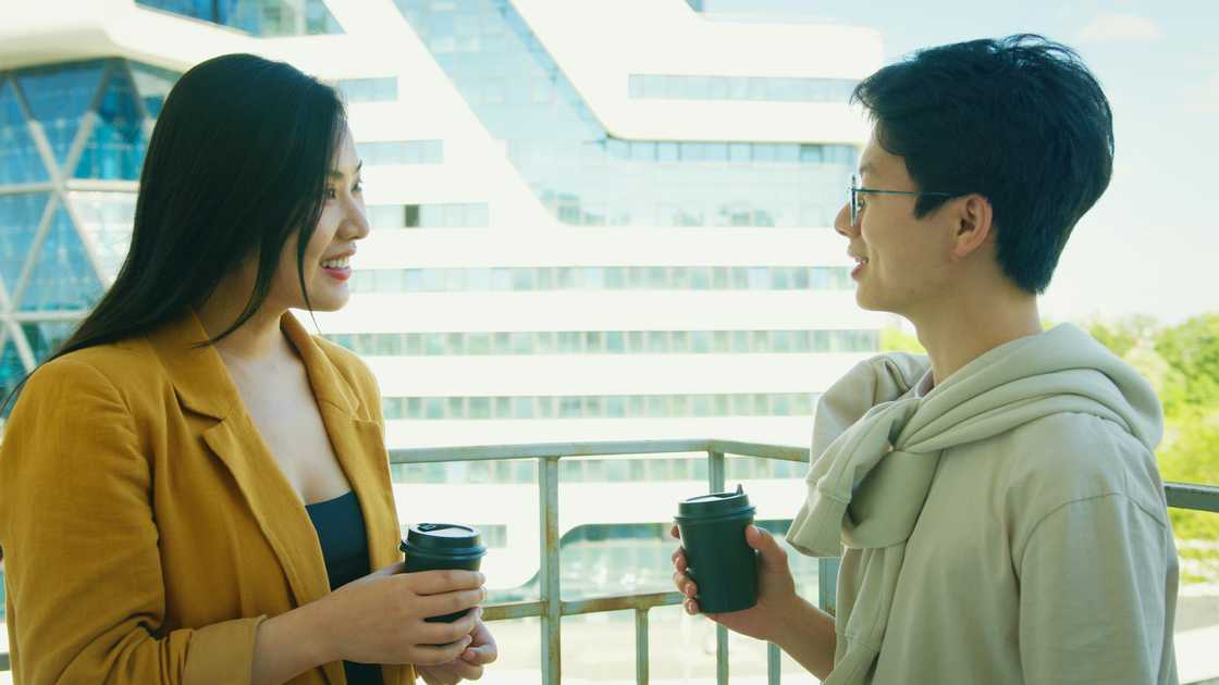 Friends talking on a balcony