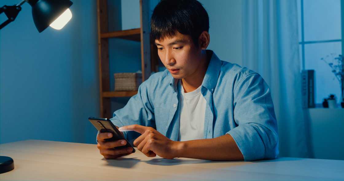 A man is scrolling on social media