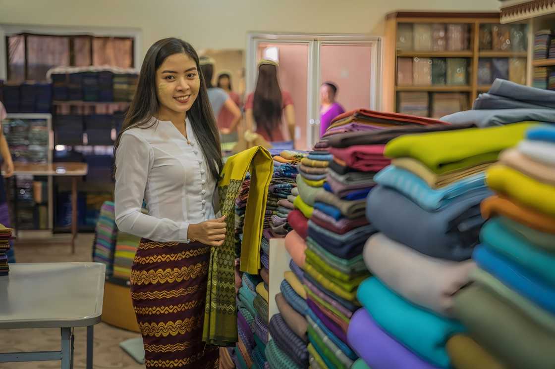 A lady in a fabric shop